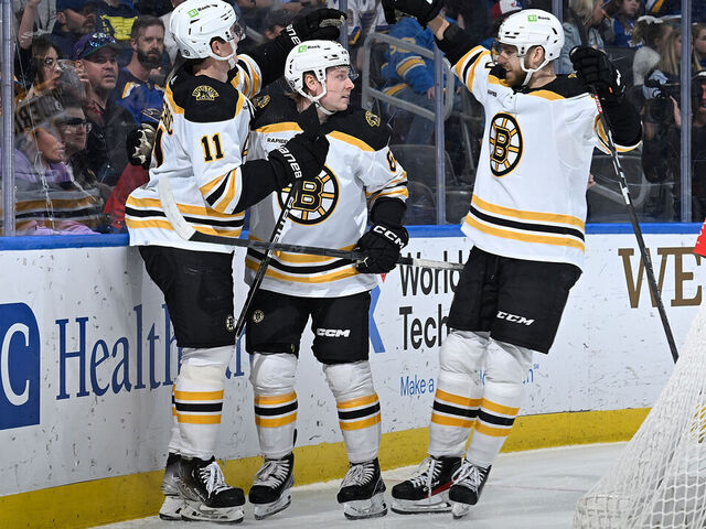 ST. LOUIS, MO - APRIL 2: Oskar Steen #62 of the Boston Bruins is congratulated after scoring a goal against the St. Louis Blues at the Enterprise Center on April 2, 2023 in St. Louis, Missouri.