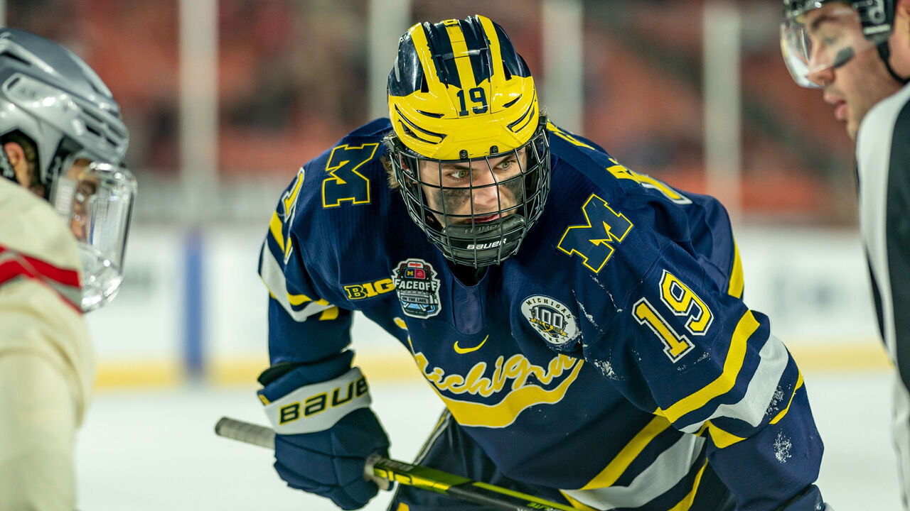 CLEVELAND, OH FEBRUARY 18: Adam Fantilli #19 of the Michigan Wolverines waits for the puck drop against the Ohio State Buckeyes during the third period of the Faceoff on the Lake NCAA ice hockey game at FirstEnergy Stadium on February 18, 2023 in Cleveland, OH. Ohio State won the game with a final score of 4-2.