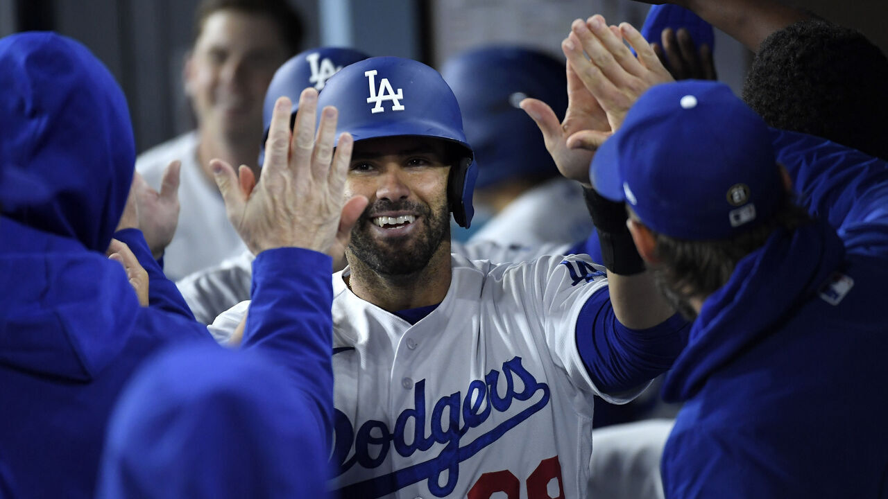 LOS ANGELES, CA - APRIL 03: J.D. Martinez #28 of the Los Angeles Dodgers celebrates after scoring a run on a triple by James Outman #33 against relief pitcher Jake Bird #59 of the Colorado Rockies during the fifth inning at Dodger Stadium on April 3, 2023 in Los Angeles, California.