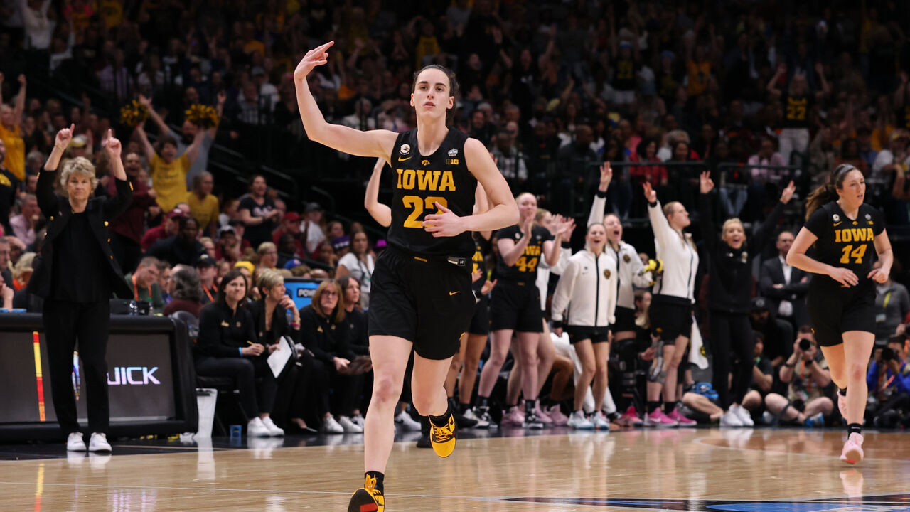 DALLAS, TEXAS - MARCH 31: Caitlin Clark #22 of the Iowa Hawkeyes reacts after a three point basket during the fourth quarter against the South Carolina Gamecocks during the 2023 NCAA Women's Basketball Tournament Final Four semifinal game at American Airlines Center on March 31, 2023 in Dallas, Texas.