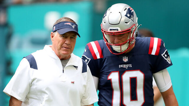 MIAMI GARDENS, FLORIDA - SEPTEMBER 11: Head coach Bill Belichick and Mac Jones #10 look on during pregame at Hard Rock Stadium on September 11, 2022 in Miami Gardens, Florida.
