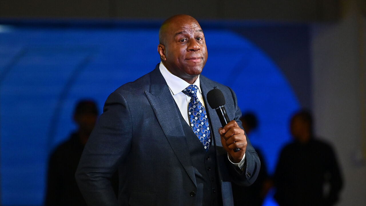 ATLANTA, GEORGIA - MARCH 17: Magic Johnson speaks during the 2023 International Poverty Forum at Delta Flight Museum on March 17, 2023 in Atlanta, Georgia.