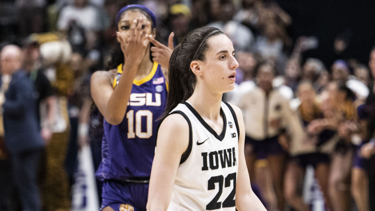 DALLAS, TEXAS - APRIL 02: Angel Reese #10 of the LSU Lady Tigers reacts in front of Caitlin Clark #22 of the Iowa Hawkeyes towards the end of the 2023 NCAA Women's Basketball Tournament championship game at American Airlines Center on April 02, 2023 in Dallas, Texas.