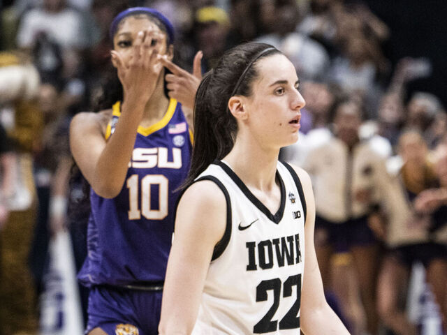 DALLAS, TEXAS - APRIL 02: Angel Reese #10 of the LSU Lady Tigers reacts in front of Caitlin Clark #22 of the Iowa Hawkeyes towards the end of the 2023 NCAA Women's Basketball Tournament championship game at American Airlines Center on April 02, 2023 in Dallas, Texas.