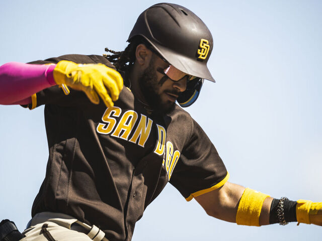 Fernando Tatis Jr. #23 of the San Diego Padres hits a three-run