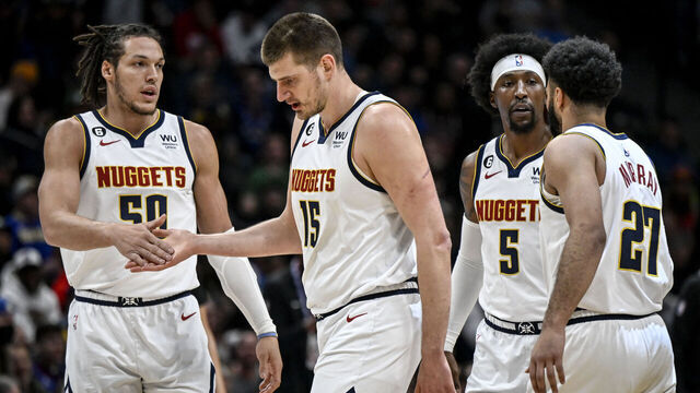 DENVER, CO - MARCH 8: Aaron Gordon (50), Nikola Jokic (15), Kentavious Caldwell-Pope (5) and Jamal Murray (27) of the Denver Nuggets head to the bench for a timeout against the Chicago Bulls during the first quarter at Ball Arena in Denver on Wednesday, March 8, 2023.