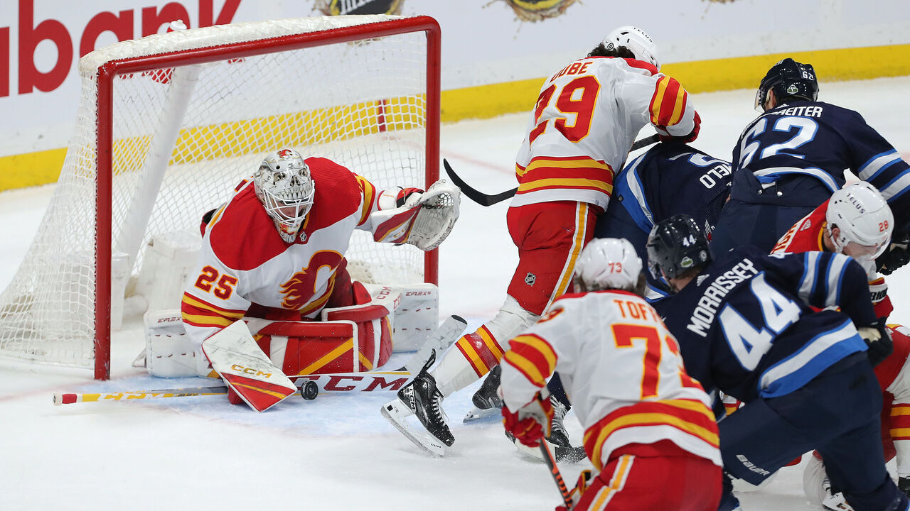 WINNIPEG, CANADA - APRIL 5: Jacob Markstrom #25 of the Calgary Flames makes a saves against the Winnipeg Jets in the third period during a game on April 5, 2023 at Canada Life Centre in Winnipeg, Manitoba, Canada.