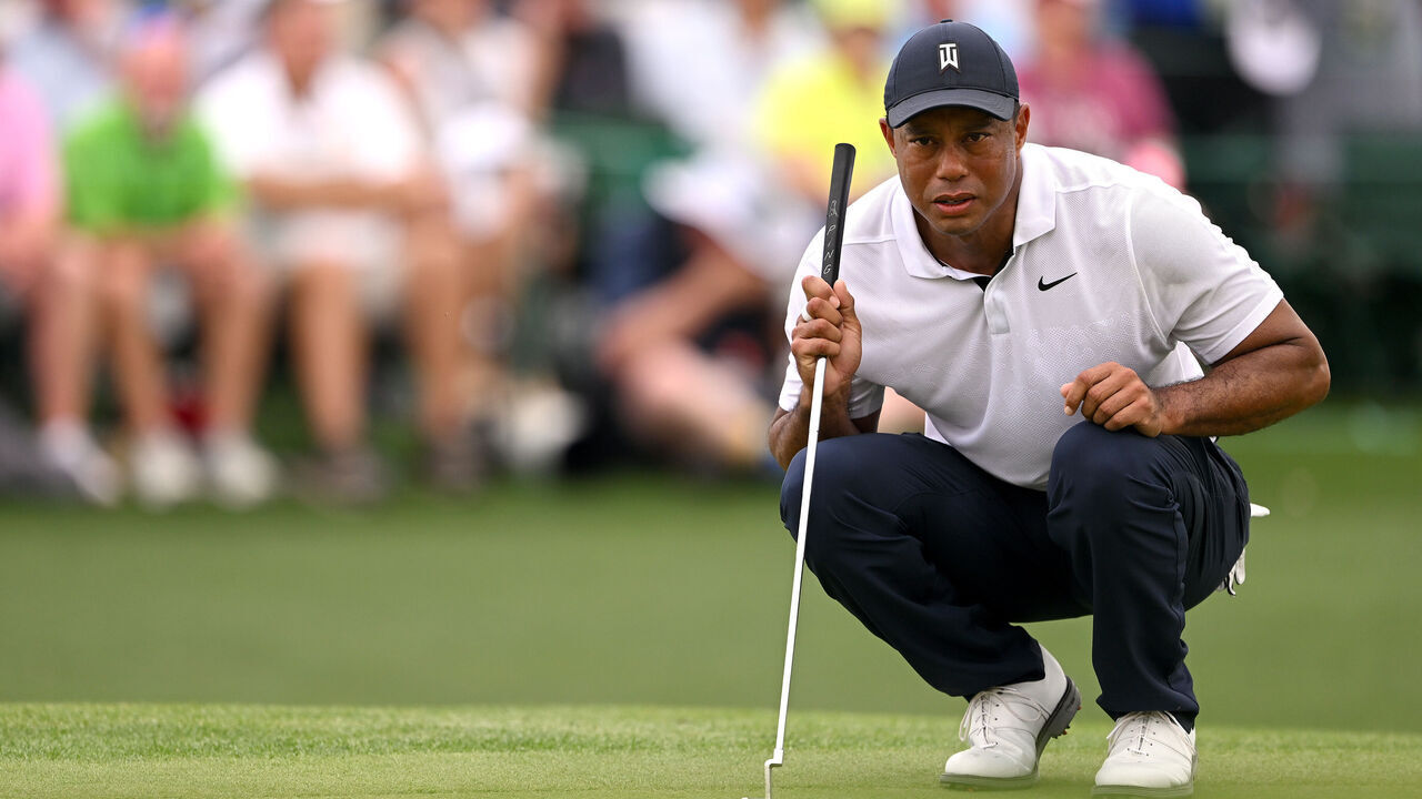 AUGUSTA, GEORGIA - APRIL 06: Tiger Woods of the United States lines up a putt on the 18th green during the first round of the 2023 Masters Tournament at Augusta National Golf Club on April 06, 2023 in Augusta, Georgia.