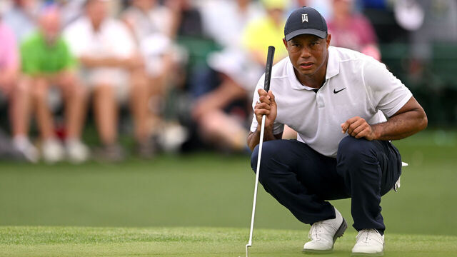 AUGUSTA, GEORGIA - APRIL 06: Tiger Woods of the United States lines up a putt on the 18th green during the first round of the 2023 Masters Tournament at Augusta National Golf Club on April 06, 2023 in Augusta, Georgia.