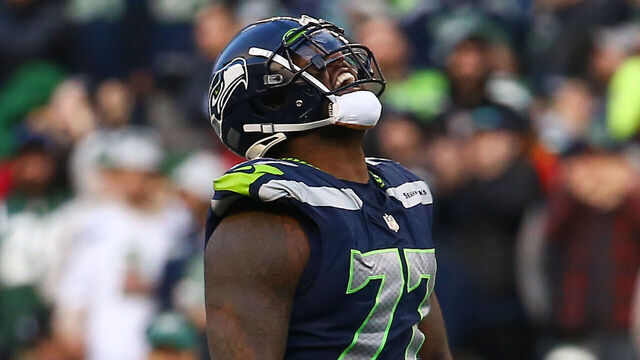 SEATTLE, WA - JANUARY 01: Quinton Jefferson #77 of the Seattle Seahawks celebrates after a sack against the New York Jets during the second half of the game at Lumen Field on January 1, 2023 in Seattle, Washington. The Seahawks won 23-6.