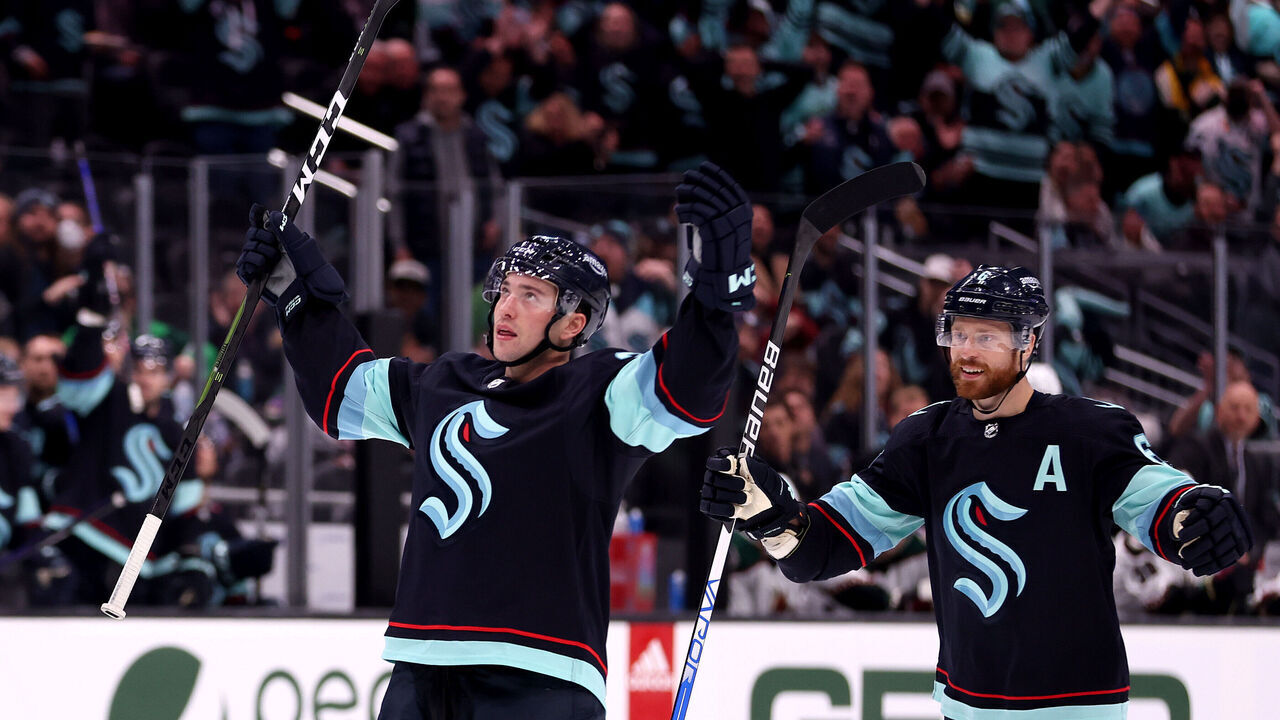 SEATTLE, WASHINGTON - APRIL 06: Vince Dunn #29 celebrates his goal with Adam Larsson #6 of the Seattle Kraken during the second period against the Arizona Coyotes at Climate Pledge Arena on April 06, 2023 in Seattle, Washington.