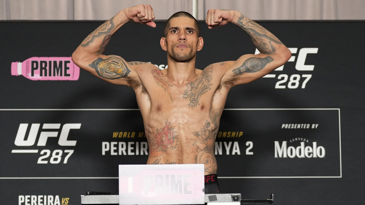 MIAMI, FLORIDA - APRIL 07: Alex Pereira of Brazil poses on the scale during the UFC 287 official weigh-in at the Hilton Downtown Miami hotel on April 07, 2023 in Miami, Florida.