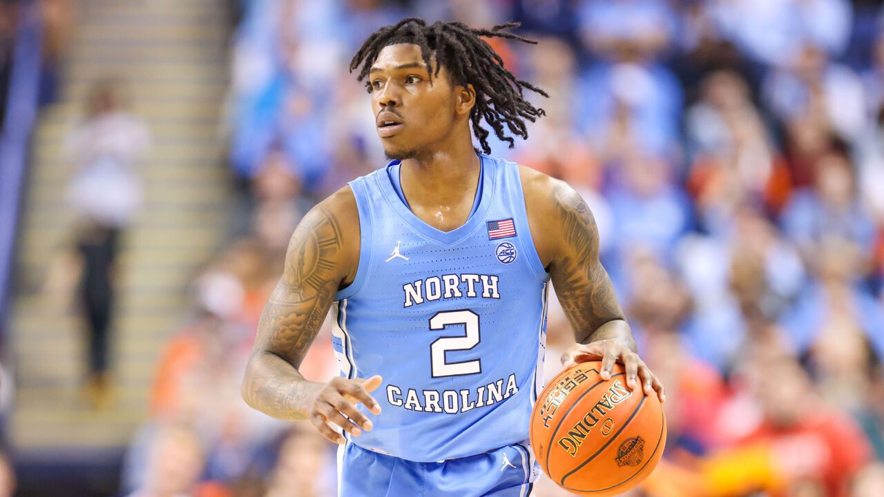 GREENSBORO, NC - MARCH 09: Caleb Love (2) of the North Carolina Tar Heels brings the ball down the court during the ACC Tournament against the Virginia Cavaliers on March 9, 2023 at Greensboro Coliseum in Greensboro, NC.