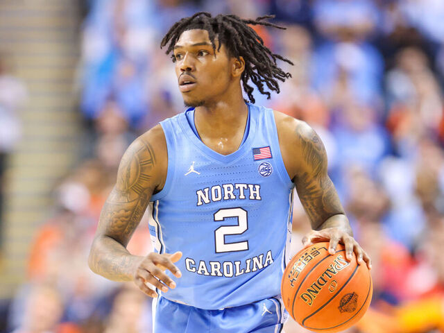 GREENSBORO, NC - MARCH 09: Caleb Love (2) of the North Carolina Tar Heels brings the ball down the court during the ACC Tournament against the Virginia Cavaliers on March 9, 2023 at Greensboro Coliseum in Greensboro, NC.