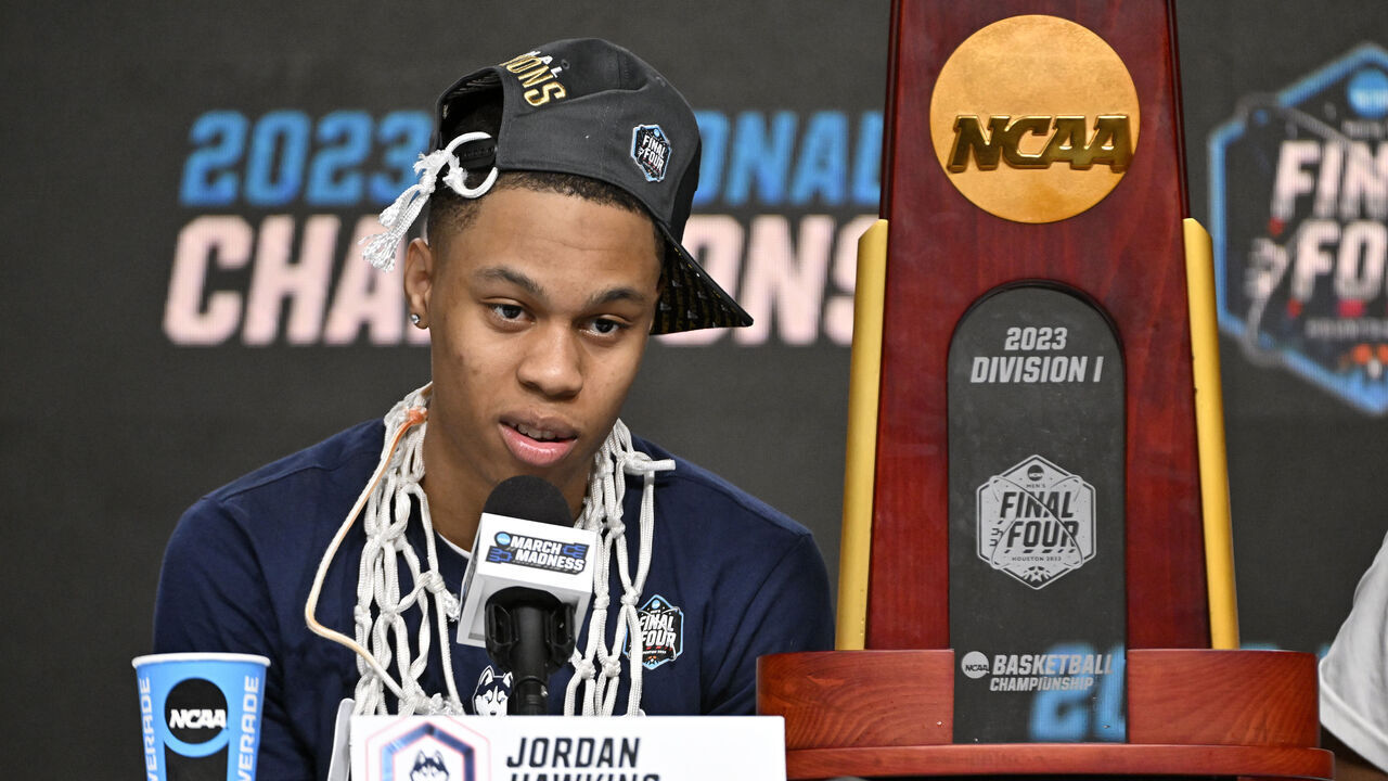 HOUSTON, TEXAS - APRIL 03: Jordan Hawkins #24 of the Connecticut Huskies answers questions during the press conference after defeating the San Diego State Aztecs 76-59 during the NCAA Men's Basketball Tournament National Championship game at NRG Stadium on April 03, 2023 in Houston, Texas.
