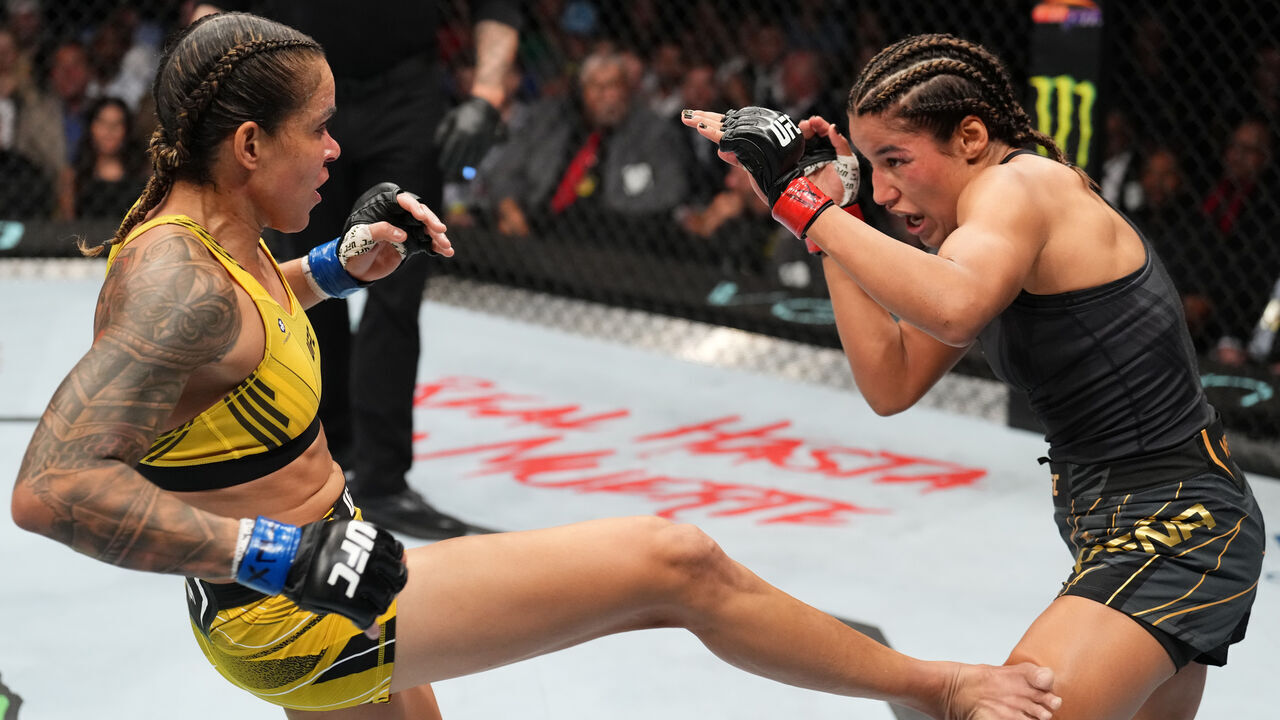 DALLAS, TEXAS - JULY 30: (L-R) Amanda Nunes of Brazil kicks Julianna Pena in the UFC bantamweight championship fight during the UFC 277 event at American Airlines Center on July 30, 2022 in Dallas, Texas.