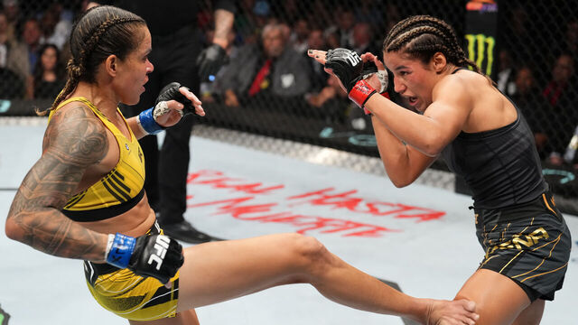 DALLAS, TEXAS - JULY 30: (L-R) Amanda Nunes of Brazil kicks Julianna Pena in the UFC bantamweight championship fight during the UFC 277 event at American Airlines Center on July 30, 2022 in Dallas, Texas.