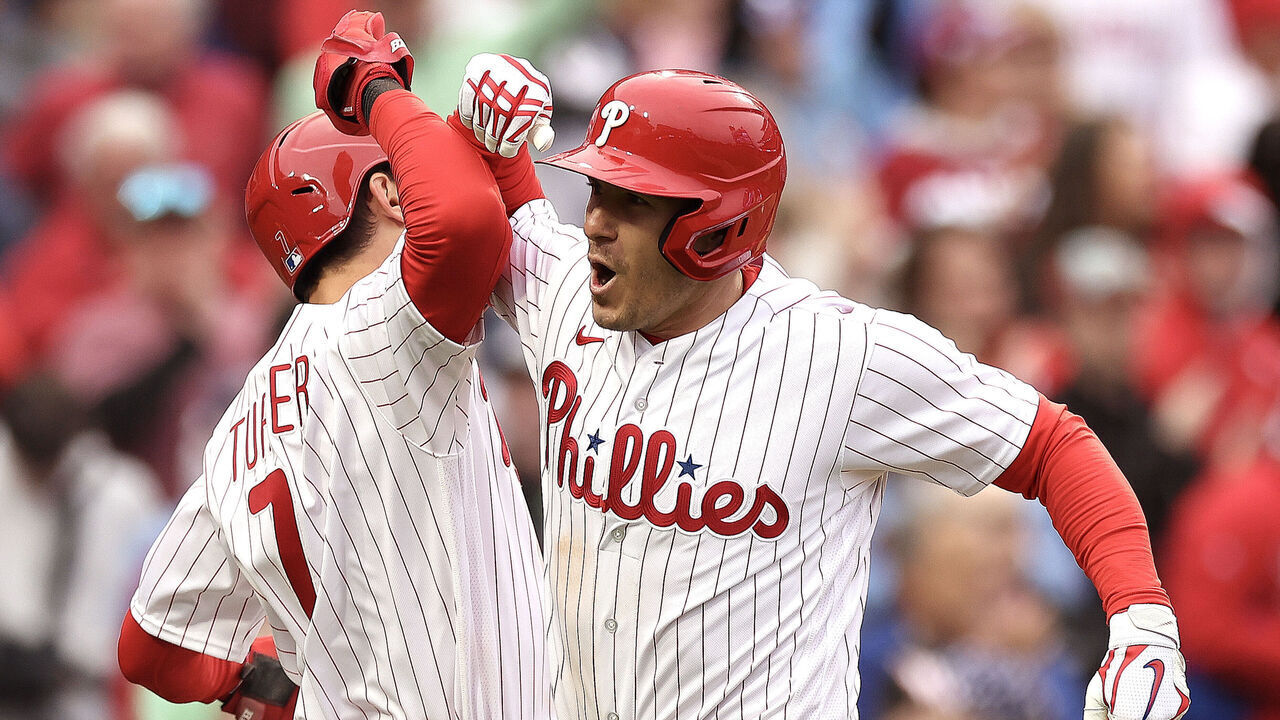 PHILADELPHIA, PENNSYLVANIA - APRIL 07: Trea Turner #7 of the Philadelphia Phillies and J.T. Realmuto #10 of the Philadelphia Phillies react following a two run home run by Realmuto during the seventh inning against the Cincinnati Reds at Citizens Bank Park on April 07, 2023 in Philadelphia, Pennsylvania.