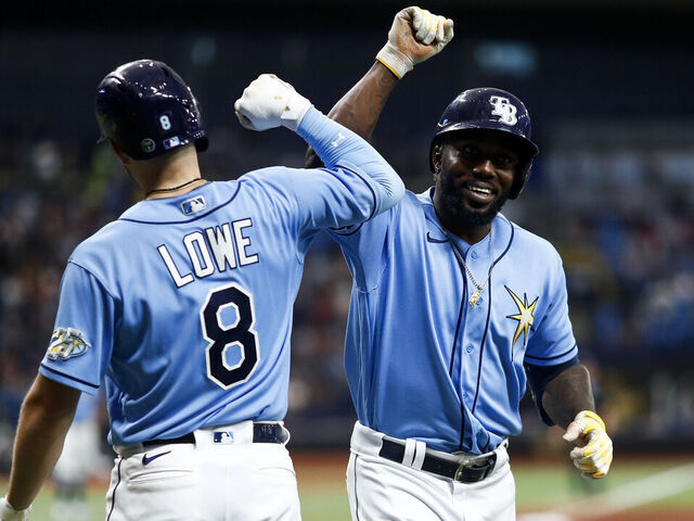 ST PETERSBURG, FLORIDA - APRIL 08: Randy Arozarena #56 of the Tampa Bay Rays celebrates with Brandon Lowe #8 after hitting a home run during the eighth inning against the Oakland Athletics at Tropicana Field on April 08, 2023 in St Petersburg, Florida.
