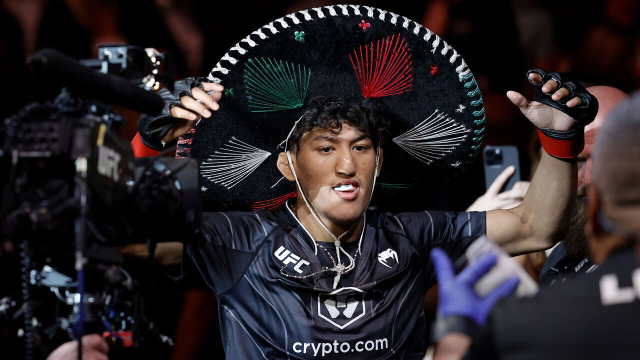 MIAMI, FLORIDA - APRIL 08: Raul Rosas Jr. enters the octagon for his bantamweight bout against Christian Rodriguez at Kaseya Center on April 08, 2023 in Miami, Florida.