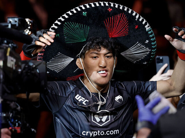 MIAMI, FLORIDA - APRIL 08: Raul Rosas Jr. enters the octagon for his bantamweight bout against Christian Rodriguez at Kaseya Center on April 08, 2023 in Miami, Florida.
