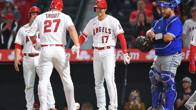 ANAHEIM, CA - APRIL 08: Los Angeles Angels designated hitter Shohei Ohtani (17) meets Los Angeles Angels center fielder Mike Trout (27) at the plate after Trouts home run during the MLB game between the Toronto Blue Jays and the Los Angeles Angels of Anaheim on April 8, 2023 at Angel Stadium of Anaheim in Anaheim, CA.