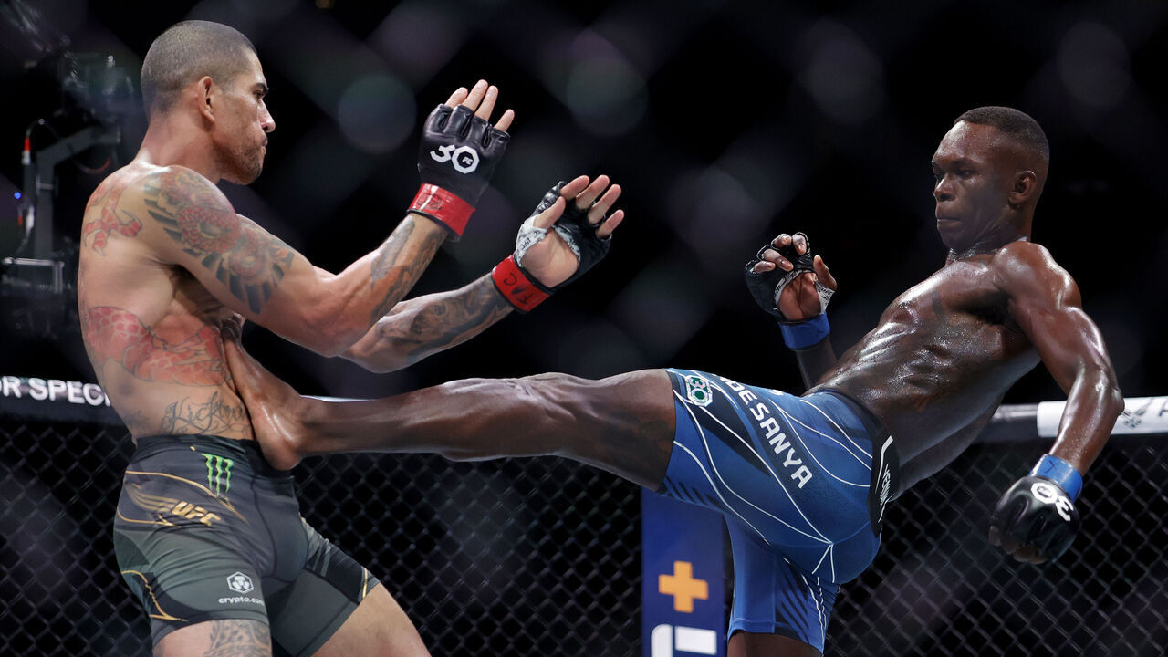 MIAMI, FLORIDA - APRIL 08: Israel Adesanya (R) of Nigeria kicks Alex Pereira of Brazil in their middleweight title bout during UFC 287 at Kaseya Center on April 08, 2023 in Miami, Florida.