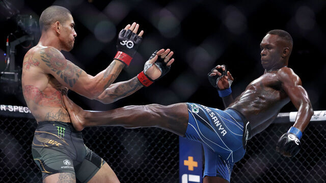 MIAMI, FLORIDA - APRIL 08: Israel Adesanya (R) of Nigeria kicks Alex Pereira of Brazil in their middleweight title bout during UFC 287 at Kaseya Center on April 08, 2023 in Miami, Florida.