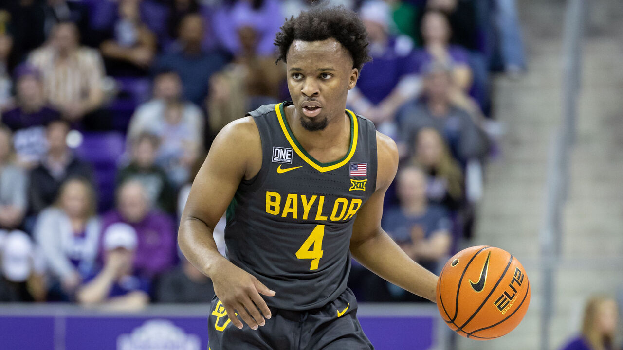 FORT WORTH, TX - FEBRUARY 11: Baylor Bears guard LJ Cryer (#4) dribbles up court during the college basketball game between the TCU Horned Frogs and Baylor Bears on February 11, 2023 at Ed & Rae Schollmaier Arena in Fort Worth, Texas.