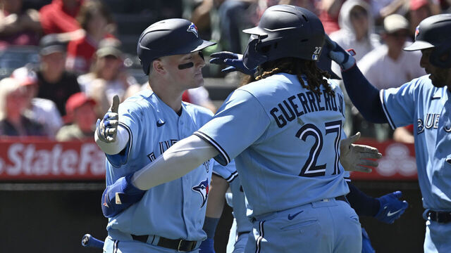 ANAHEIM, CA - APRIL 09: Matt Chapman #26 of the Toronto Blue Jays celebrates his grand slam home run with Vladimir Guerrero Jr. #27 against the Los Angeles Angels in the sixth inning at Angel Stadium of Anaheim on April 9, 2023 in Anaheim, California.