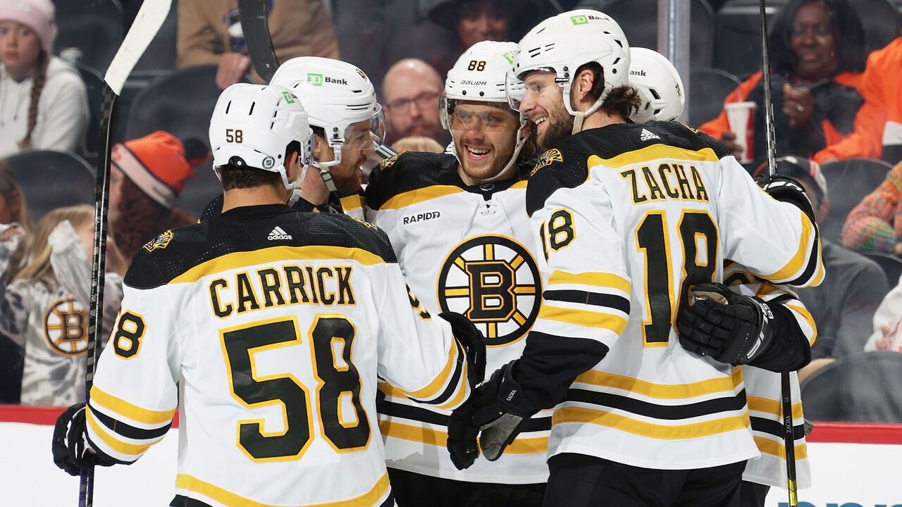 PHILADELPHIA, PENNSYLVANIA - APRIL 09: David Pastrnak #88 of the Boston Bruins celebrates the second of his two second period goals against the Philadelphia Flyers with Connor Carrick #58, Matt Grzelcyk #48, and Pavel Zacha #18 at the Wells Fargo Center on April 9, 2023 in Philadelphia, Pennsylvania.