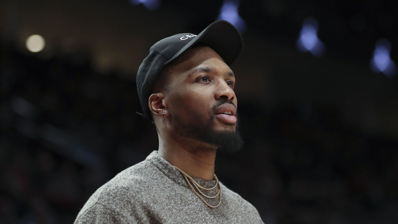 PORTLAND, OREGON - MARCH 27: Damian Lillard #0 of the Portland Trail Blazers reacts to a call during the second quarter against the New Orleans Pelicans at Moda Center on March 27, 2023 in Portland, Oregon.