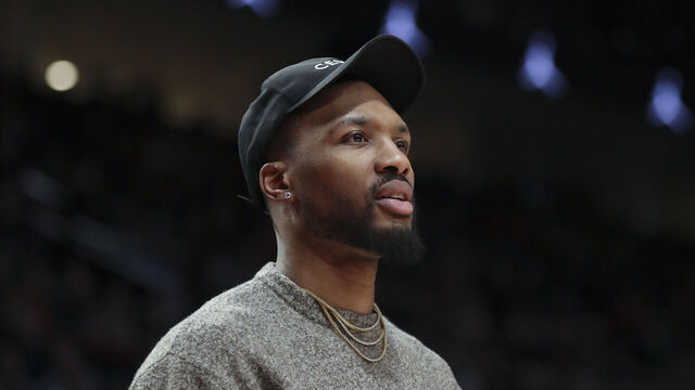 PORTLAND, OREGON - MARCH 27: Damian Lillard #0 of the Portland Trail Blazers reacts to a call during the second quarter against the New Orleans Pelicans at Moda Center on March 27, 2023 in Portland, Oregon.