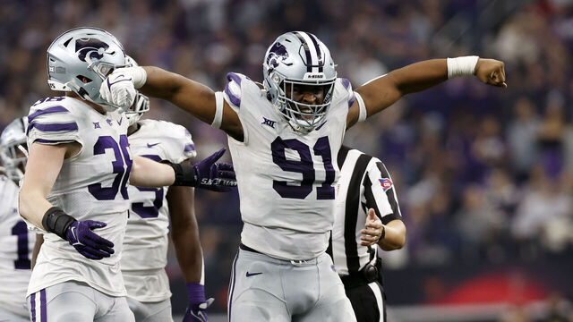 ARLINGTON, TEXAS - DECEMBER 03: Defensive end Felix Anudike-Uzomah #91 of the Kansas State Wildcats reacts after making a sack against the TCU Horned Frogs in the second half of the Big 12 Championship game at AT&T Stadium on December 03, 2022 in Arlington, Texas.
