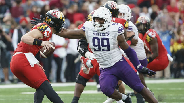 COLLEGE PARK, MD - OCTOBER 22: Northwestern Wildcats defensive lineman Adetomiwa Adebawore (99) goes after Maryland Terrapins quarterback Billy Edwards Jr. (9) during a Big10 football game between the Maryland Terrapins and the Northwestern Wildcats, on October 22, 2022, at SECU Stadium, in College Park, Maryland.