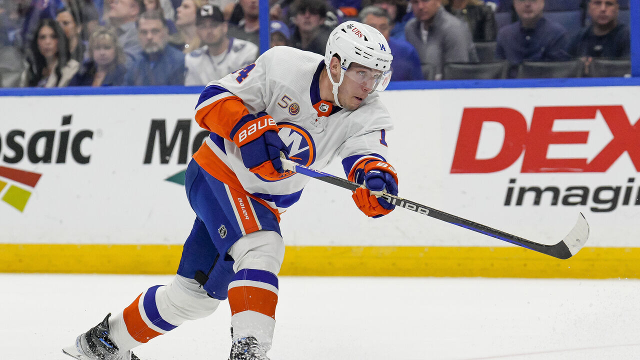 TAMPA, FL - APRIL 01: New York Islanders center Bo Horvat (14) shoots the puck during the NHL Hockey match between the Tampa Bay Lightning and New York Islanders on April 1st 2023 at Amalie Arena in Tampa, FL.