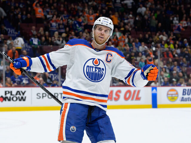 VANCOUVER, BC - JANUARY 21: Edmonton Oilers center Connor McDavid (97) celebrates after a goal during their NHL game against the Vancouver Canucks at Rogers Arena on January 21, 2023 in Vancouver, British Columbia, Canada.