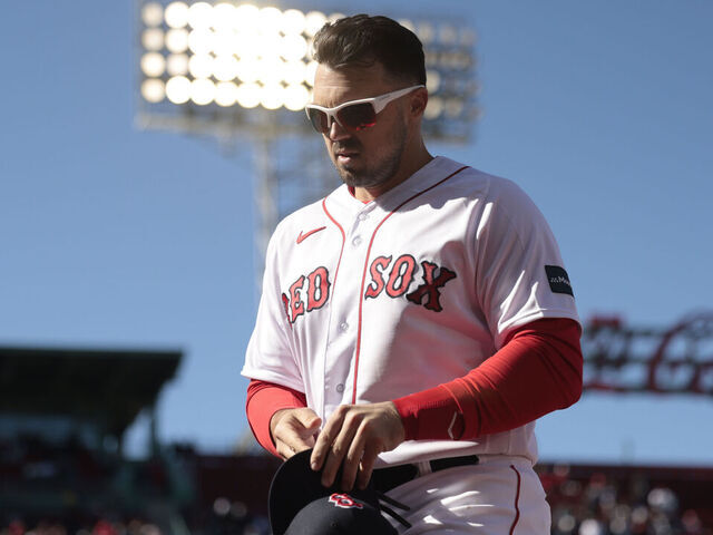 BOSTON, MASSACHUSETTS - APRIL 02: Adam Duvall #18 of the Boston Red Sox looks on during the seventh inning against the Baltimore Orioles at Fenway Park on April 02, 2023 in Boston, Massachusetts.