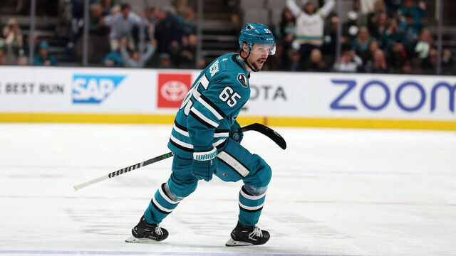 SAN JOSE, CALIFORNIA - APRIL 06: Erik Karlsson #65 of the San Jose Sharks skates back to congratulate Steven Lorentz #16 of the San Jose Sharks after Lorentz scored against the Colorado Avalanche in the second period at SAP Center on April 06, 2023 in San Jose, California. Karlsson assisted on the goal, and the assist was his 100th point of the season.