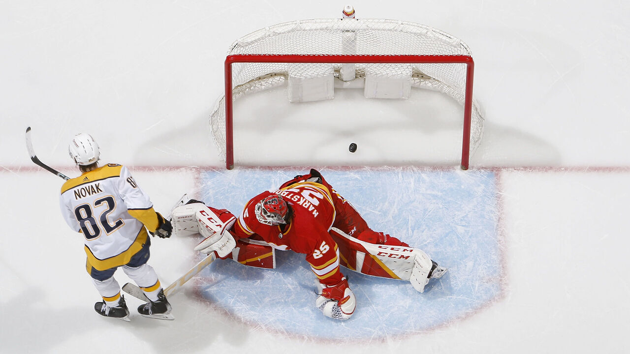 CALGARY, AB - APRIL 10: Thomas Novak #82 of the Nashville Predators scores the game winner in the shootout against the Calgary Flames at Scotiabank Saddledome on April 10, 2023 in Calgary, Alberta, Canada.