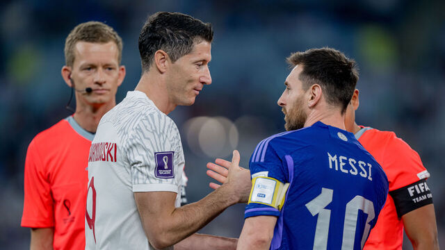 DOHA, QATAR - NOVEMBER 30: Lionel Messi (R) of Argentina shake hands with Robert Lewandowski of Poland during the FIFA World Cup Qatar 2022 Group C match between Poland and Argentina at Stadium 974 on November 30, 2022 in Doha, Qatar.