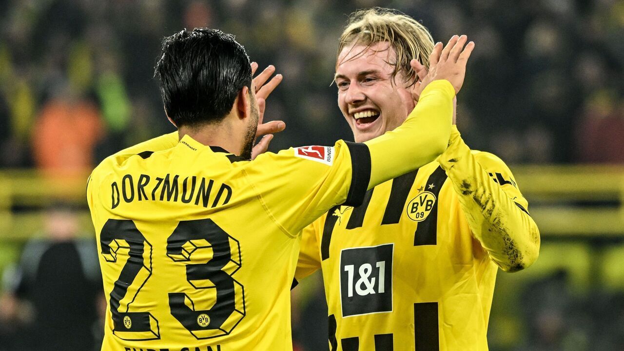 Dortmund's German midfielder Emre Can (L) celebrates with Dortmund's German midfielder Julian Brandt after scoring during the German first division Bundesliga football match between Borussia Dortmund and RB Leipzig in Dortmund on March 3, 2023.
