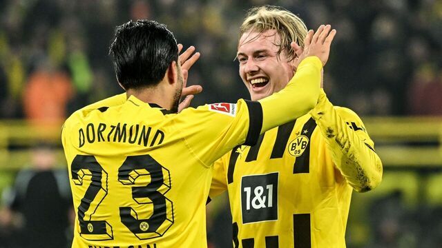Dortmund's German midfielder Emre Can (L) celebrates with Dortmund's German midfielder Julian Brandt after scoring during the German first division Bundesliga football match between Borussia Dortmund and RB Leipzig in Dortmund on March 3, 2023.