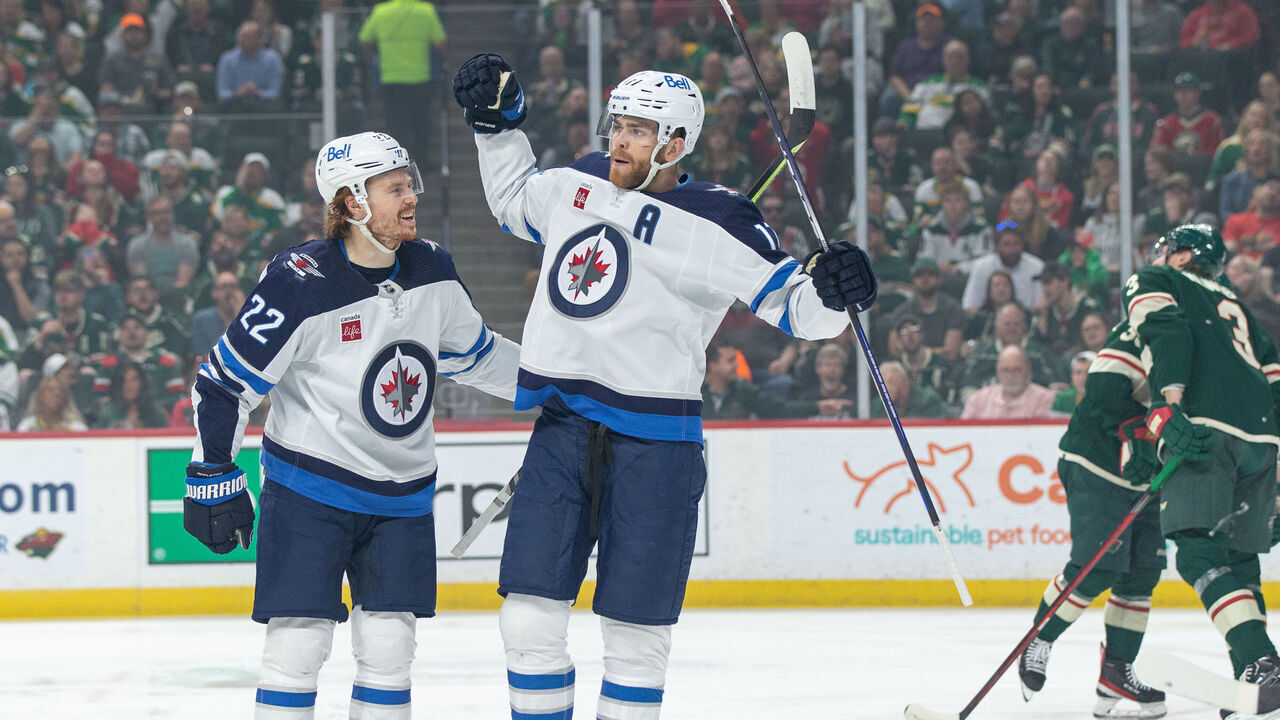 SAINT PAUL, MN - APRIL 11: Winnipeg Jets center Adam Lowry (17) celebrates after a goal with Winnipeg Jets center Mason Appleton (22) during the NHL game between the Winnipeg Jets and Minnesota Wild, on April 11th, 2023, at the Xcel Energy Center in Saint Paul, MN.