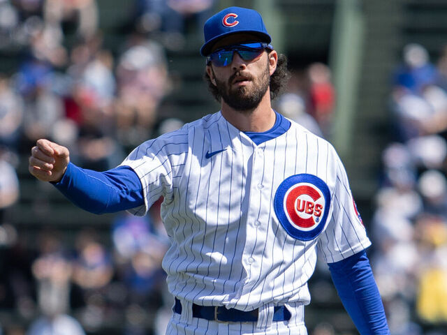 CHICAGO, IL - APRIL 09: Chicago Cubs shortstop Dansby Swanson (7) warms up before a Major League Baseball game between the Texas Rangers and the Chicago Cubs on April 09, 2023 at Wrigley Field in Chicago, IL.