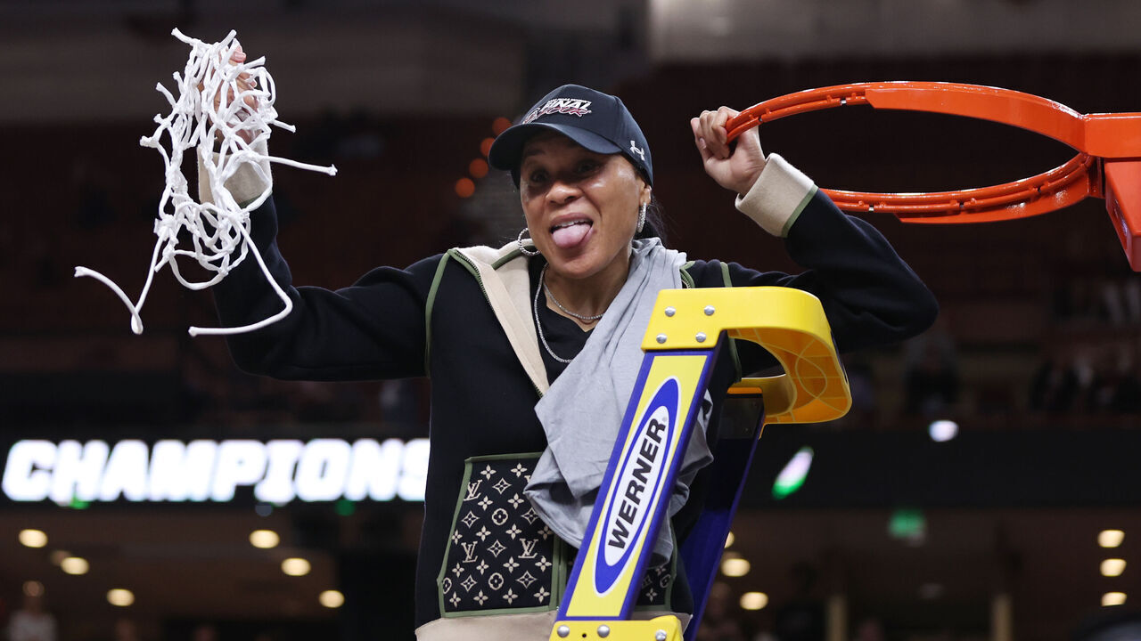 GREENVILLE, SOUTH CAROLINA - MARCH 27: Head coach Dawn Staley of the South Carolina Gamecocks celebrates after defeating the Maryland Terrapins 86-75 in the Elite Eight round of the NCAA Women's Basketball Tournament at Bon Secours Wellness Arena on March 27, 2023 in Greenville, South Carolina.