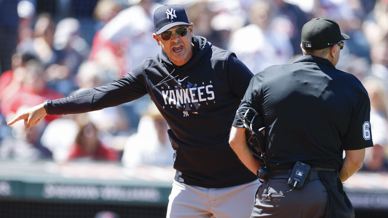 CLEVELAND, OH - APRIL 12: Aaron Boone #17 of the New York Yankees argues a review call with home plate umpire Chris Guccione #68 after being ejected from the game during the first inning at Progressive Field on April 12, 2023 in Cleveland, Ohio.