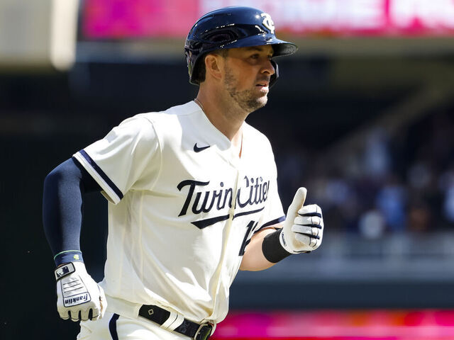 MINNEAPOLIS, MN - APRIL 08: Kyle Farmer #12 of the Minnesota Twins rounds the bases on his three-run home run against the Houston Astros in the second inning of the game at Target Field on April 8, 2023 in Minneapolis, Minnesota. The Twins defeated the Astros 9-6.