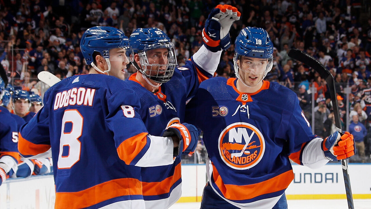 ELMONT, NEW YORK - APRIL 12: (L-R) Noah Dobson #8, Brock Nelson #29 and Pierre Engvall #18 of the New York Islanders celebrate Nelson's second period goal against the Montreal Canadiens at the UBS Arena on April 12, 2023 in Elmont, New York.