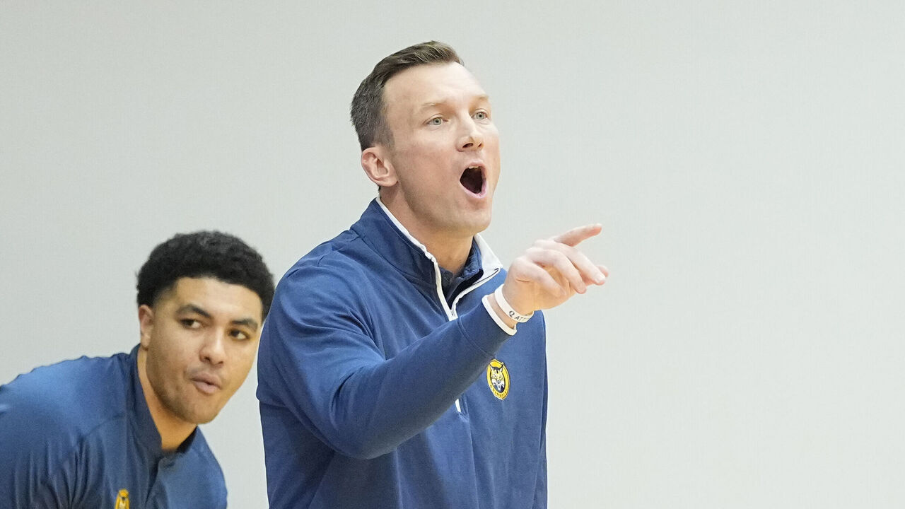 LAWRENCEVILLE, NJ - JANUARY 06: Quinnipiac Bobcats Head Coach Baker Dunleavy speaks to his players on the court during the first half of the college basketball game between the Quinnipiac Bobcats and Rider Broncs on January 6.2023, at Alumni Gymnasium in Lawrenceville, NJ.